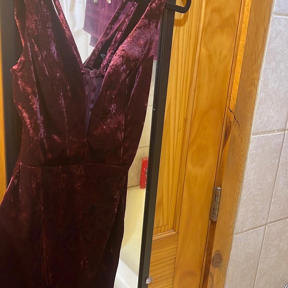 Very gorgeous suede dress. Color is a dark maroon, very beautiful color.